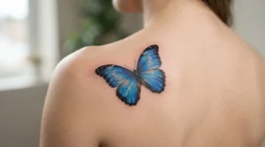 blue butterfly tattoo with morpho wings on a shoulder blade