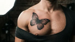 butterfly tattoo for men in black and grey realism on the chest